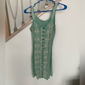 Mini light green dress with front buttons